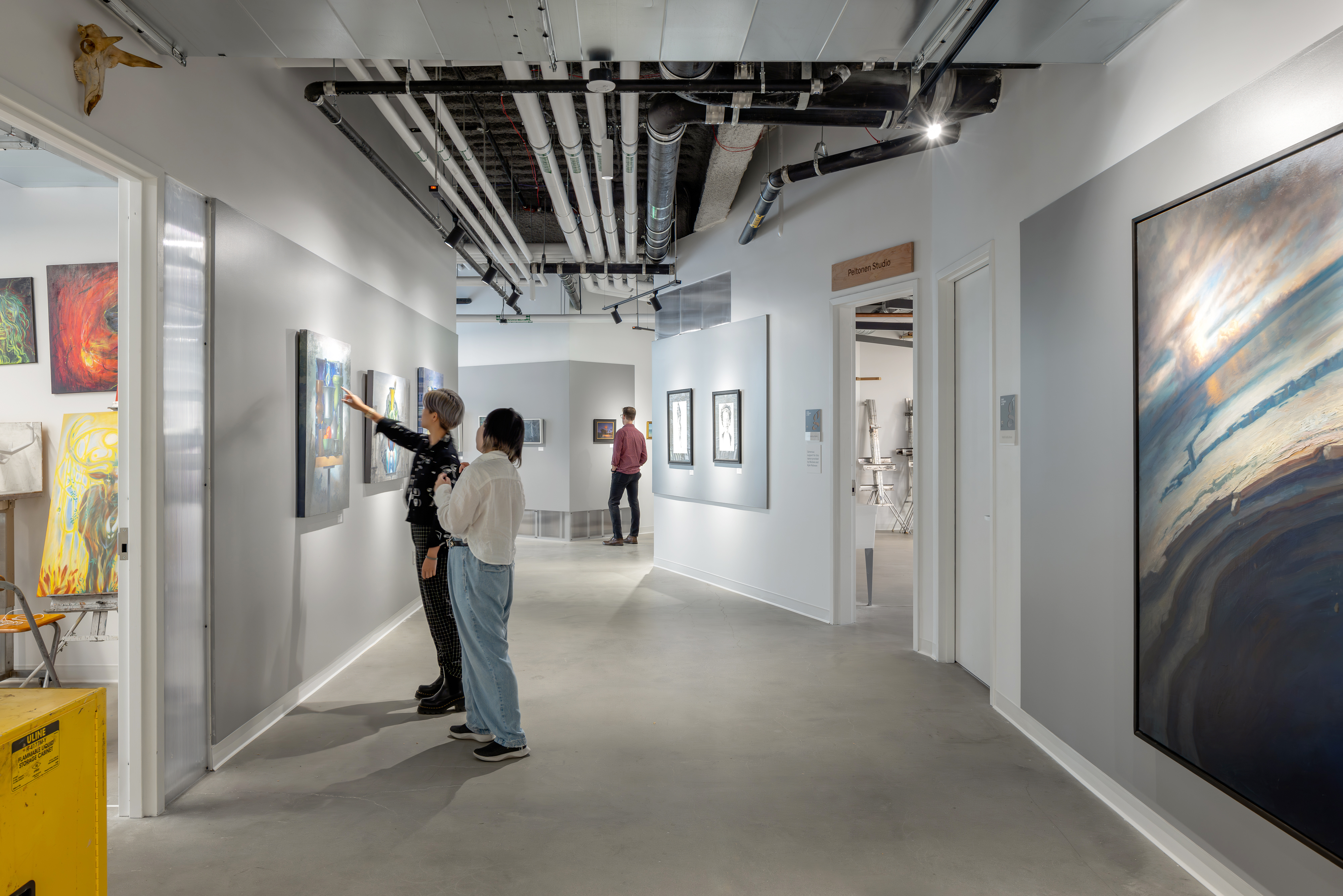 People gather in Gage’s gallery space during an open event. 